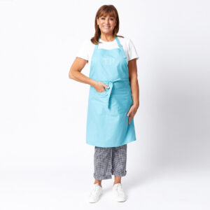 tina nettlefold wearing blue apron