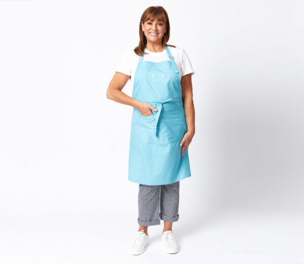 tina nettlefold wearing blue apron